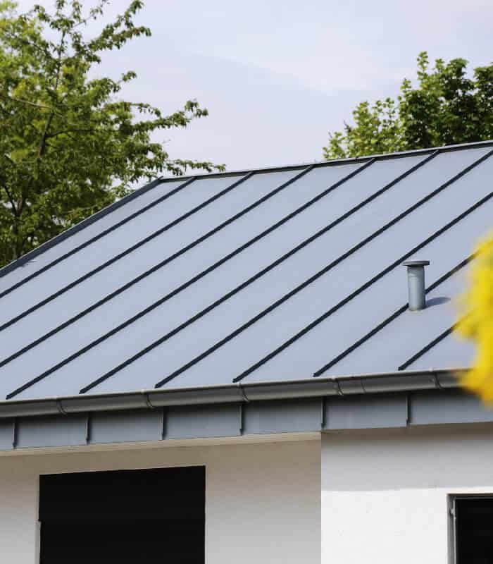 Experienced Roofing Contractors Performing A Metal Roof Replacement In Jacksonville, FL